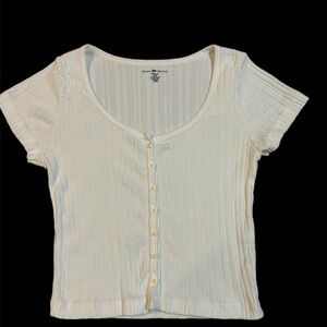 4 very gently used Brandy Melville tops. First 3 are white, last is pink.